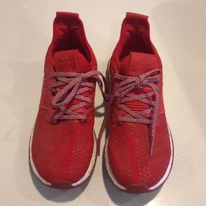 Men’s red Adidas Boost tennis shoes